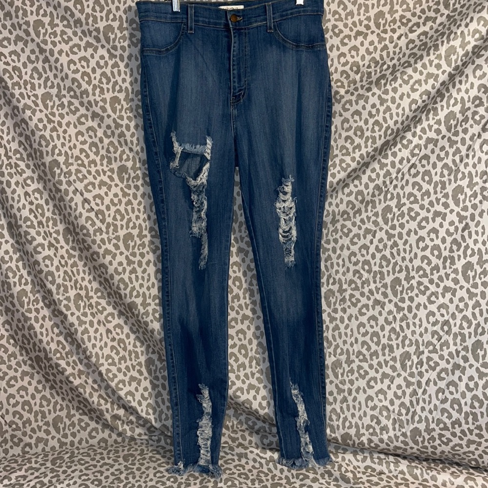 Vibrant gently worn high waist distressed skinny leg jeans